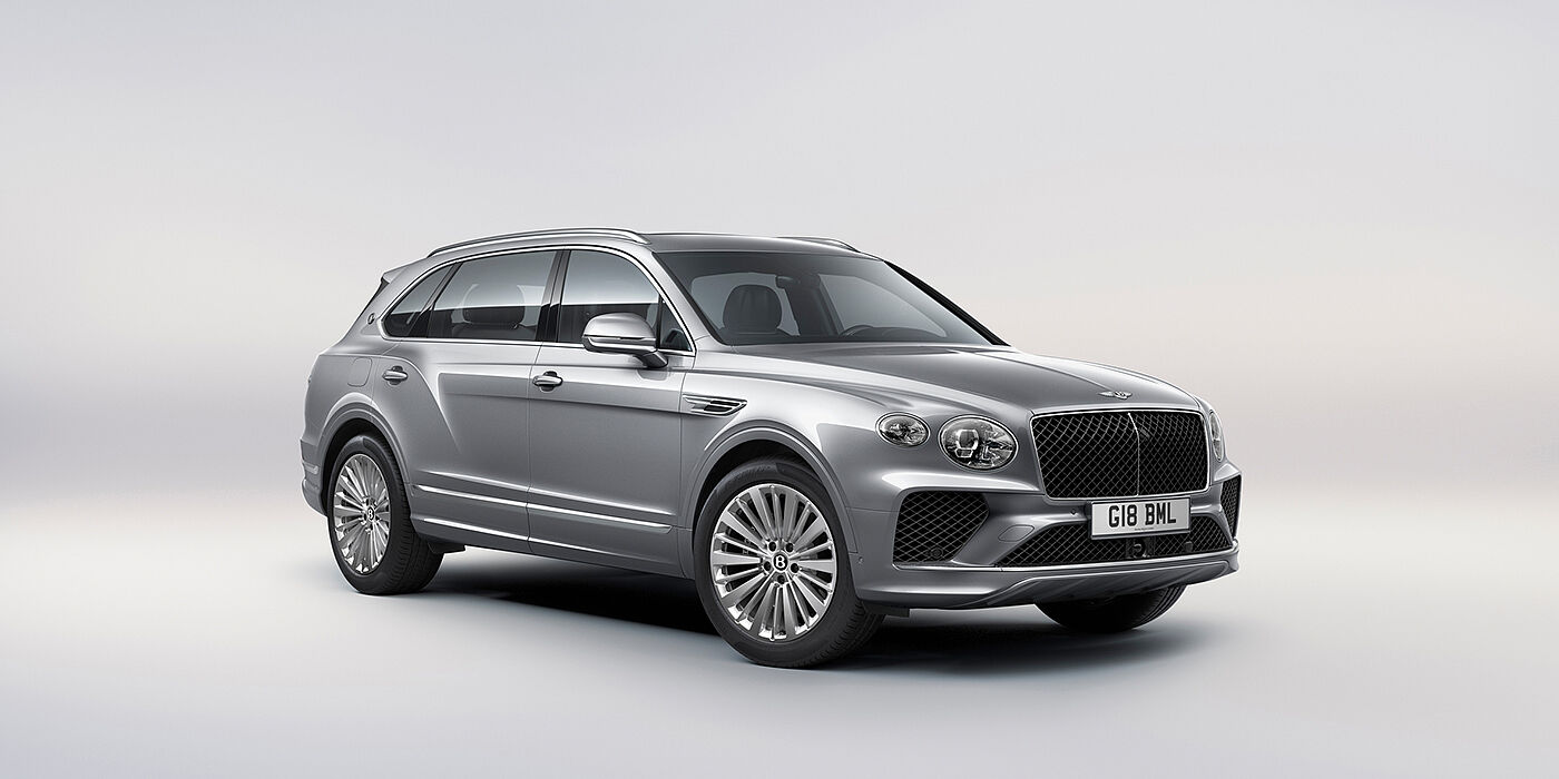 Bentley Monterrey Bentley Bentayga Extended Wheelbase luxury SUV front three quarter view in Moonbeam paint with 21 inch five spoke painted wheels