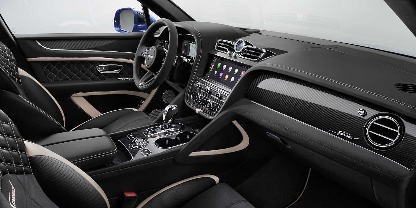 Bentley Monterrey Bentley Bentayga Speed SUV front interior in Beluga black and Linen hide with carbon fibre veneer