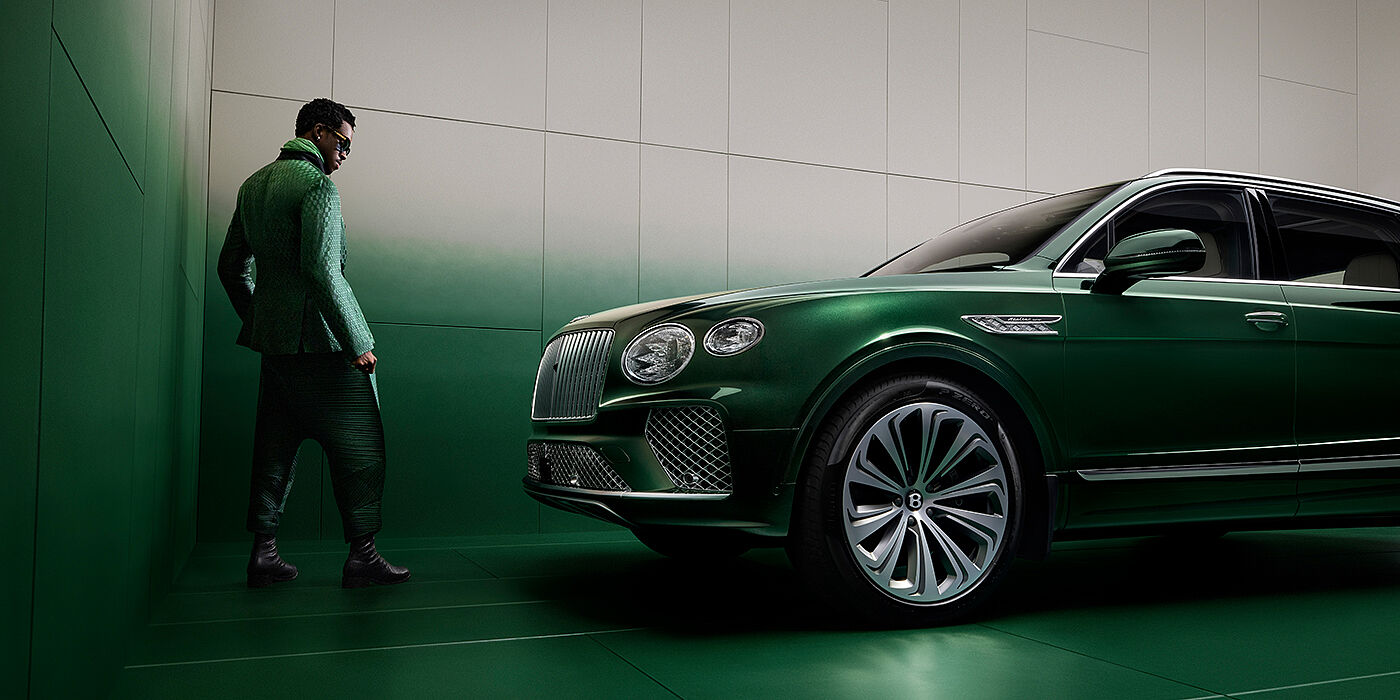 Bentley Monterrey Wisdom K standing next to Bentley Bentayga Extended Wheelbase SUV in Light Emerald green paint in profile