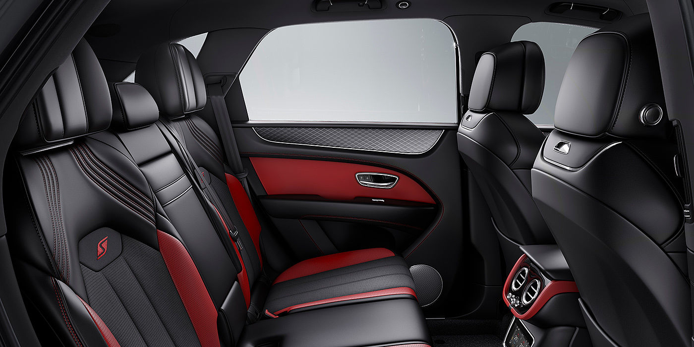 Bentley Monterrey Bentey Bentayga S interior view for rear passengers with Beluga black and Hotspur red coloured hide.